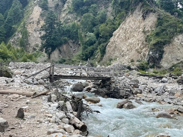 wooden bridge across a small river