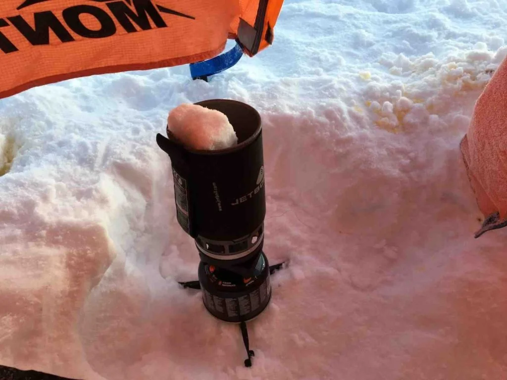 Melting snow for water