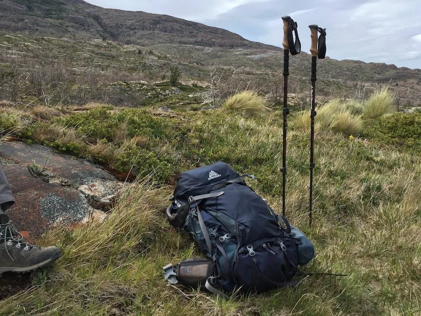 backpack and trekking poles