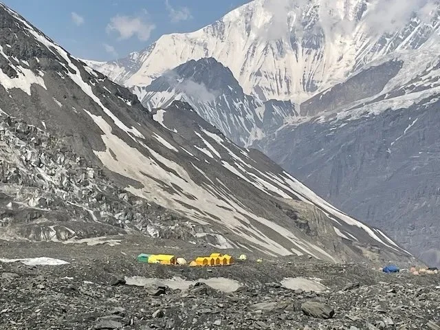 Our first sight of Dhaulagiri Base Camp - tents with mountains towering behind