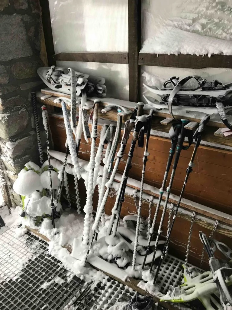 Snow inside the refugio on all the trekking poles