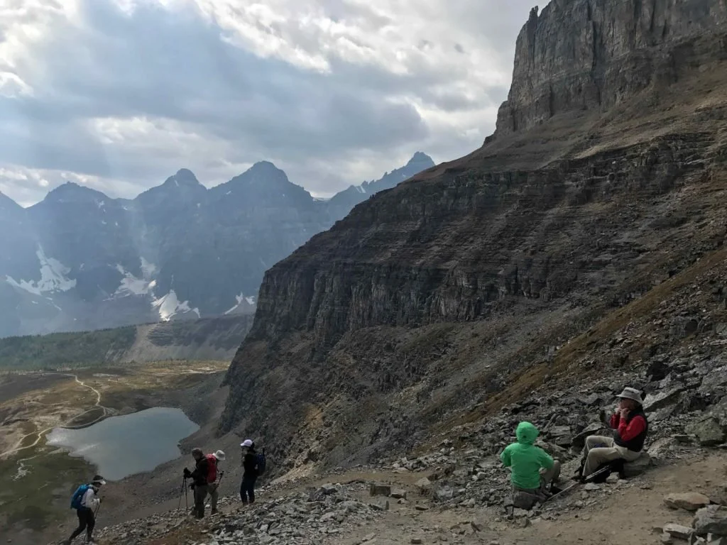 view of a lake and mountain backdrop from rocky area at top of Sentinel Pass