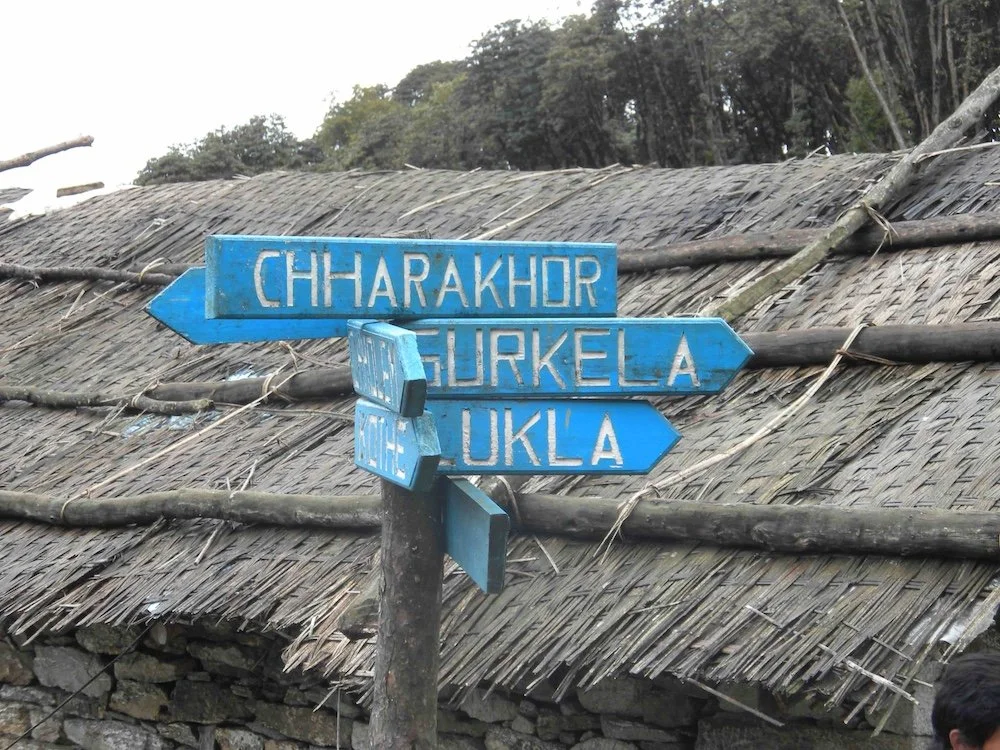 a signpost at a village on the Mera Peak trek