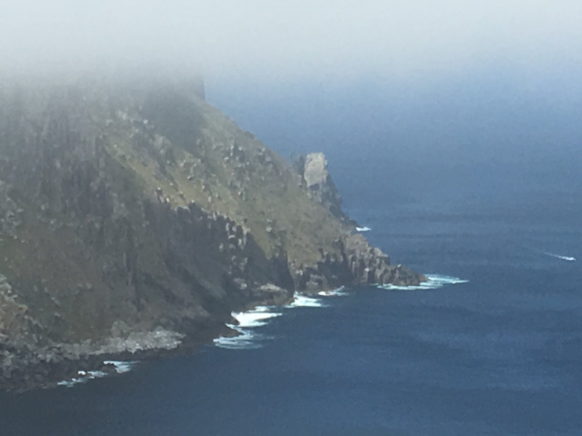 Ancient sea cliffs through the mist