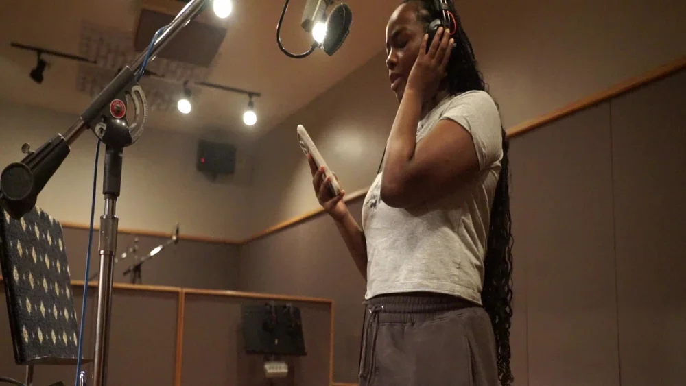At the mic, 2026
