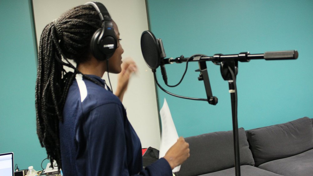At the mic, 2015