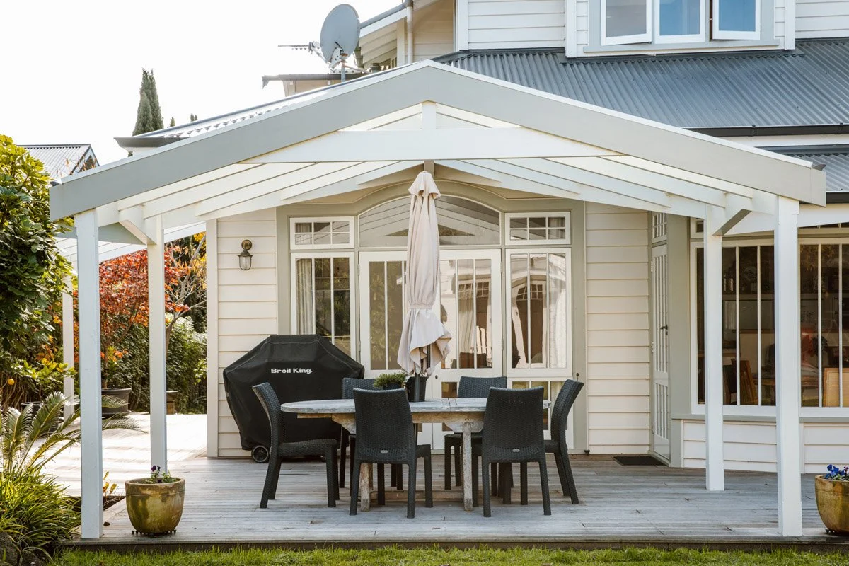 Covered outdoor entertaining area and timber deck added as part of a character home renovation in Hauraki, Auckland.