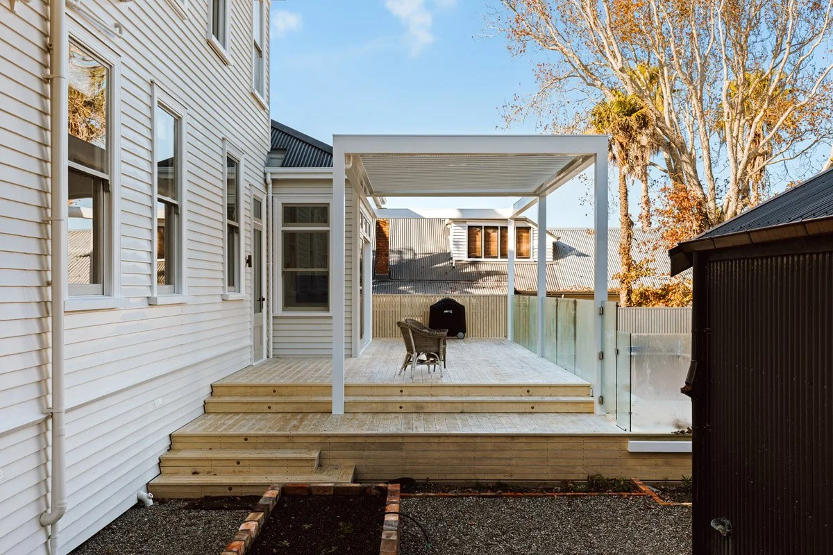 Outdoor living deck extension at a renovated character home in Auckland, featuring covered entertaining space and seamless indoor-outdoor flow.