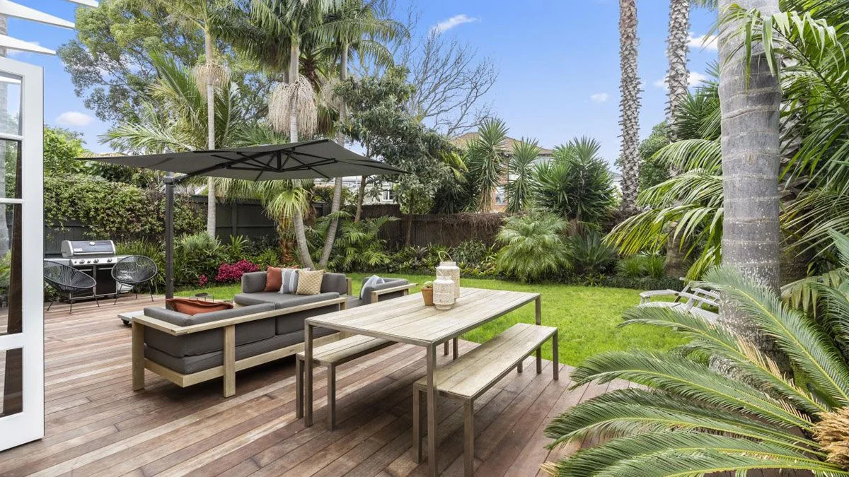 Rear extension and outdoor living area integrated with existing character home