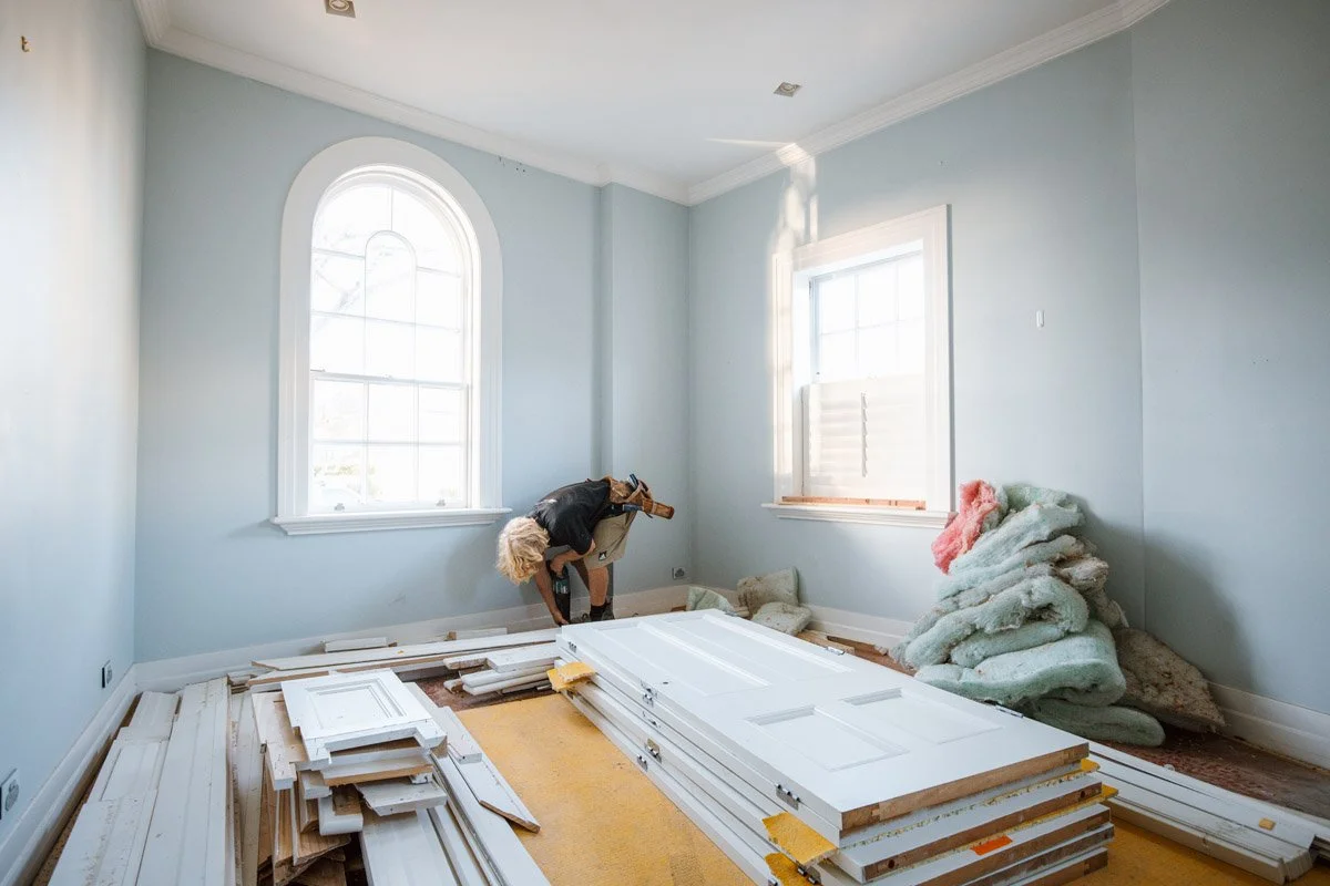 Character bedroom undergoing restoration with original windows, wall linings and heritage detailing retained during a premium Auckland renovation.