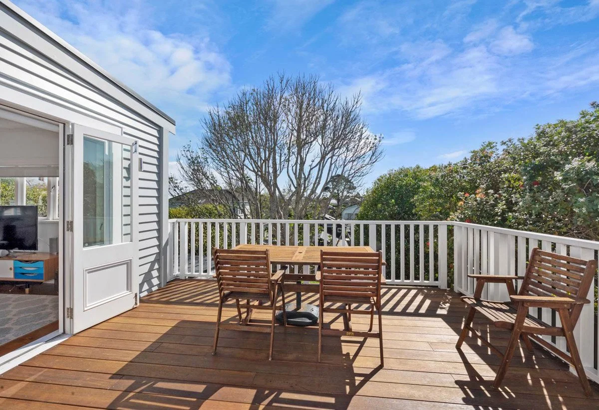 Elevated timber deck providing additional outdoor living space overlooking landscaped grounds in Devonport.