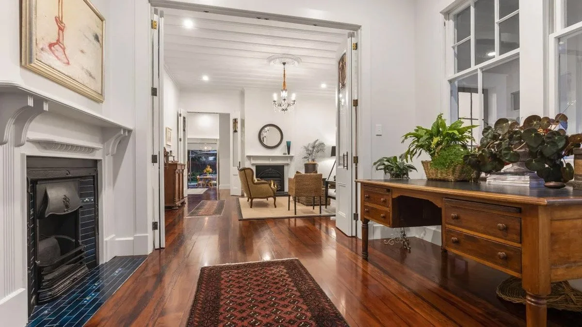 Restored hallway with polished timber flooring and preserved heritage detailing