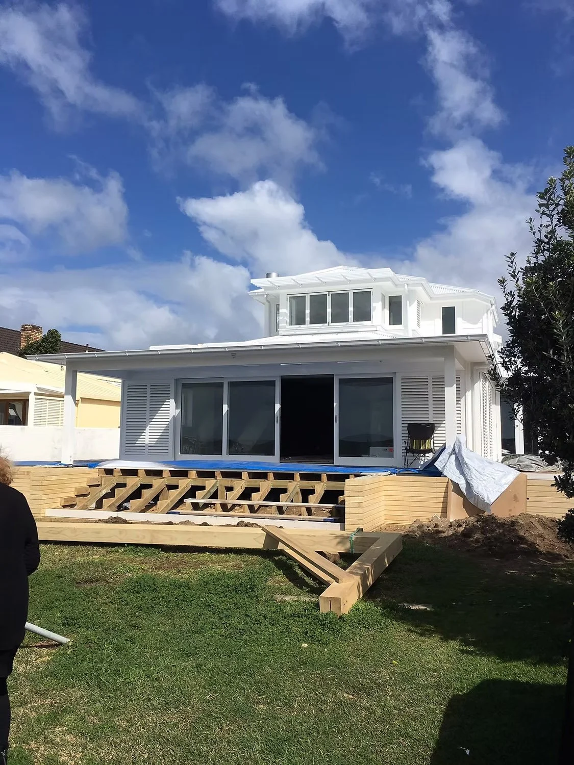Indoor outdoor flow from Milford coastal home renovation opening toward beachfront