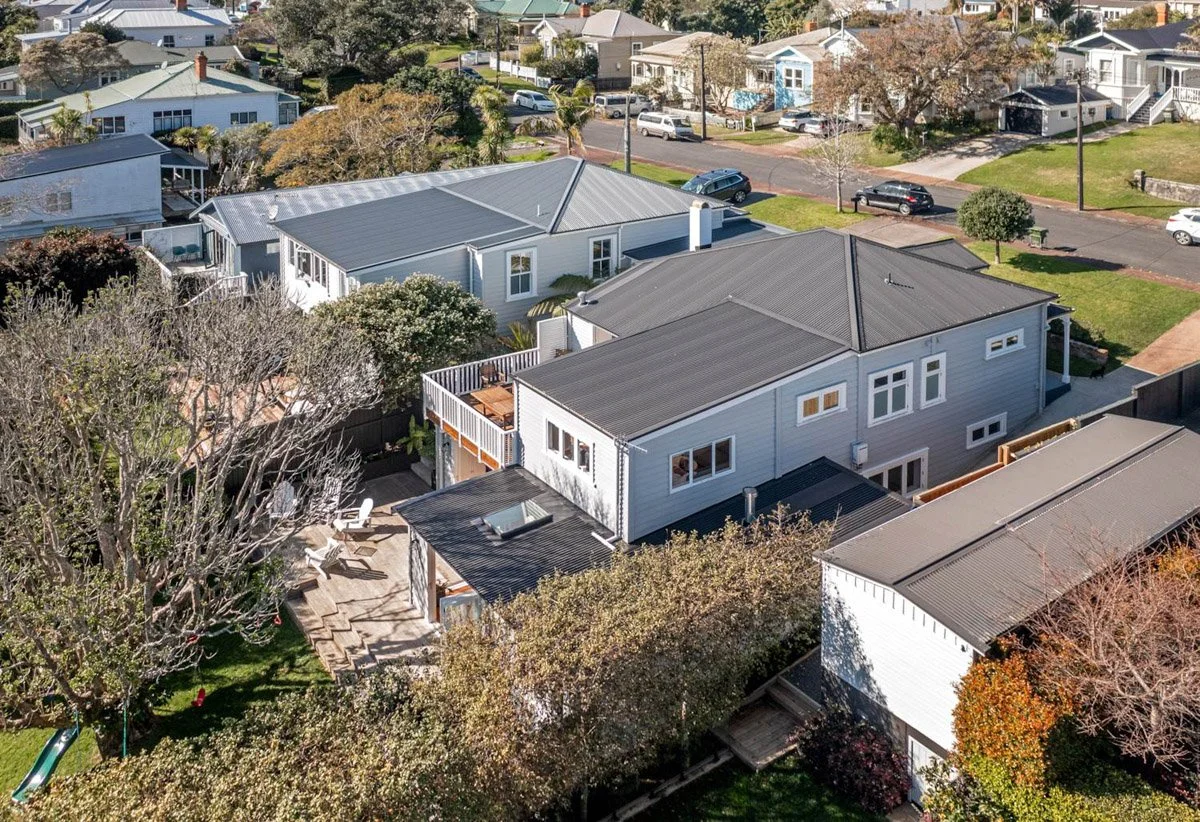 Aerial view of completed Devonport villa renovation showcasing basement addition, upper-level rebuild and landscaping works.