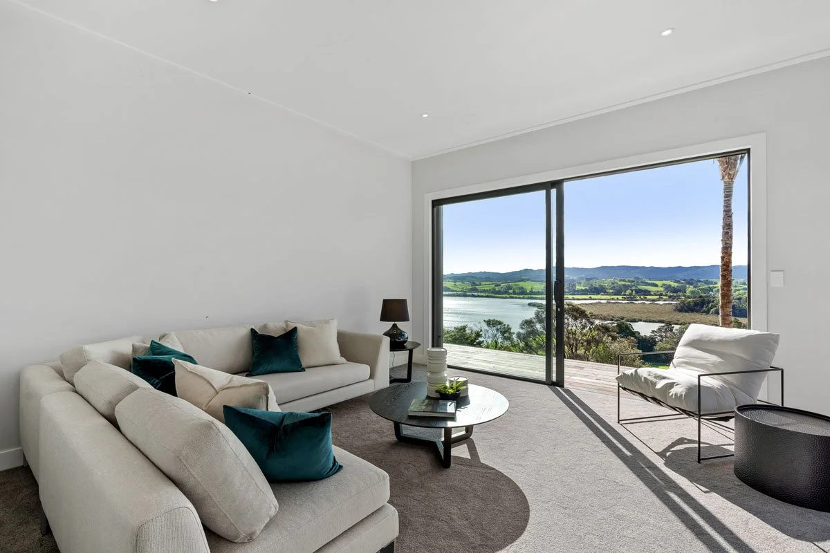 Lounge area with indoor outdoor flow overlooking Matakana waterways