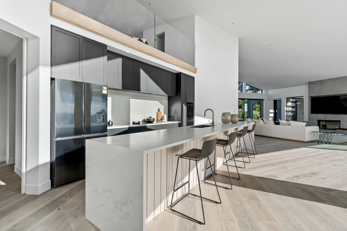 Kitchen and living area inside Matakana architectural country home