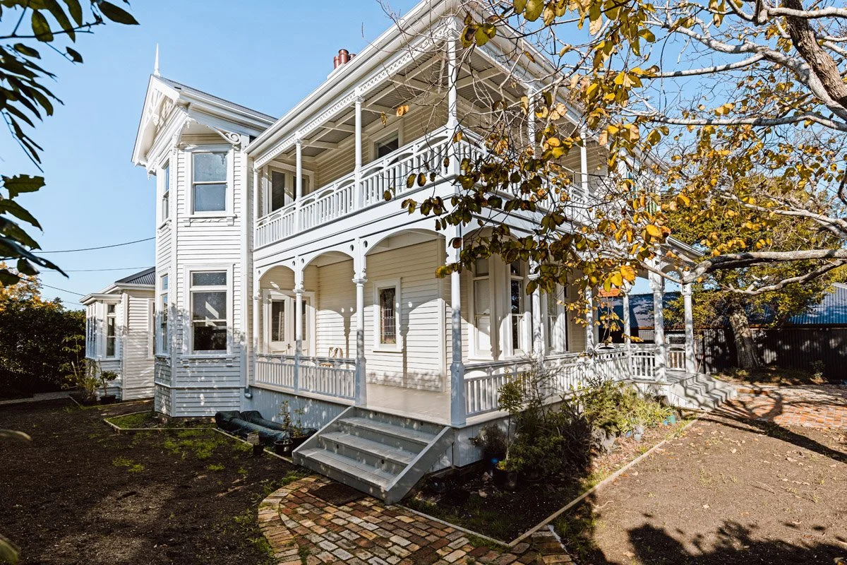 Fully restored character home in Narrow Neck, Auckland, showcasing heritage architecture, decorative timberwork and premium craftsmanship.