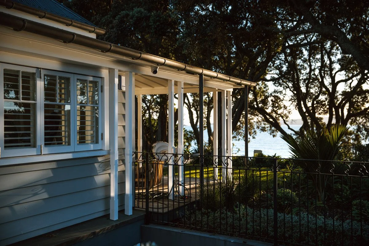 Covered verandah overlooking Cheltenham Beach during a luxury character home renovation in Devonport Auckland.