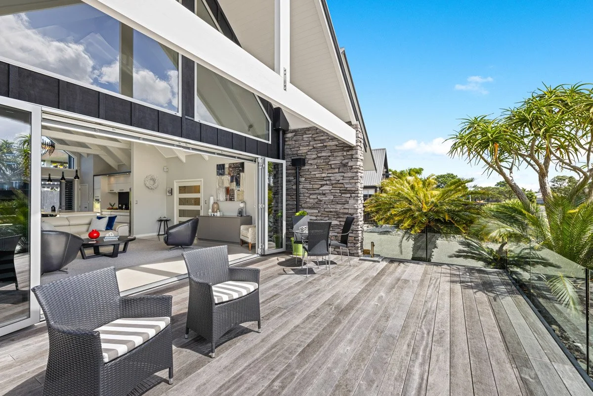 Timber deck overlooking Omaha harbour with indoor outdoor flow from the main living area.