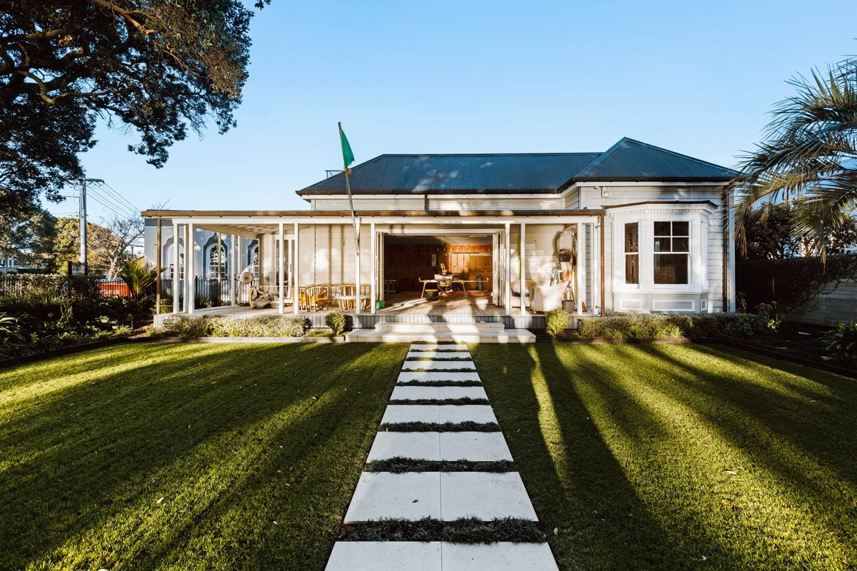 Garden elevation of a restored character home in Devonport with heritage architecture and coastal setting.