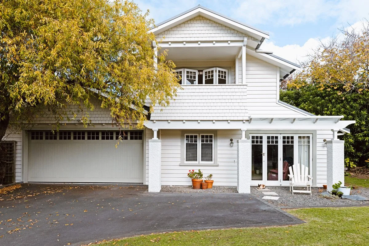 Character home renovation in Hauraki showcasing a heritage-inspired garage addition and restored exterior detailing.