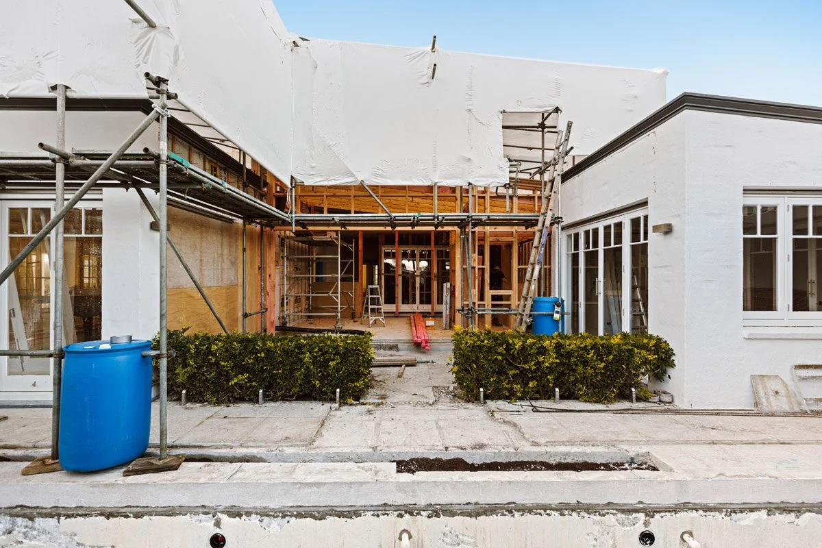 Luxury home extension and pool renovation project under construction by Coast & Country Homes, showcasing structural alterations and outdoor living improvements in Auckland.