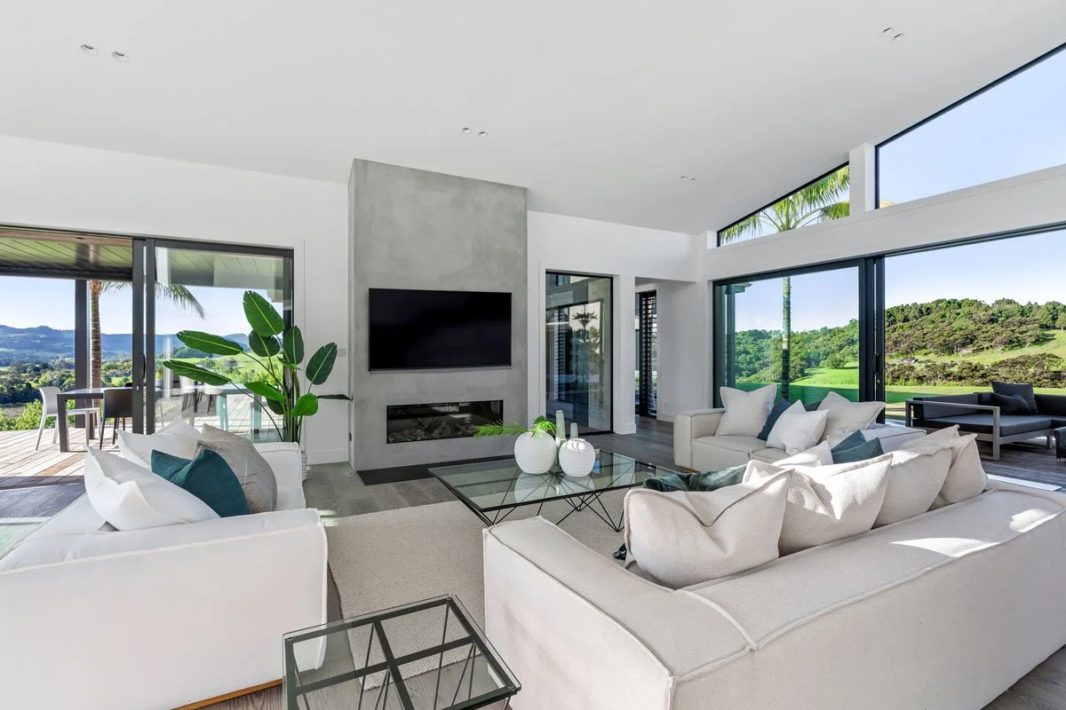 Architectural interior with high ceilings and rural outlook in Matakana