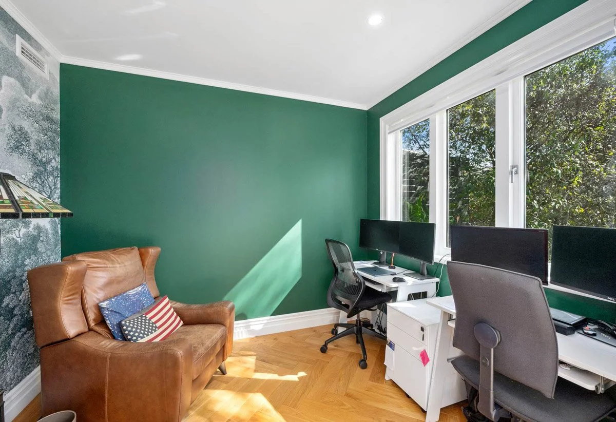Dedicated home office space with custom finishes and natural light within renovated Devonport family home.