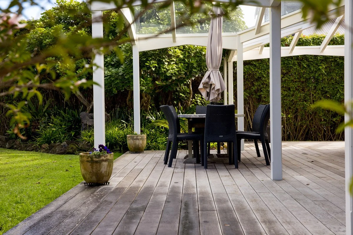 Covered outdoor entertaining area and timber deck added as part of a character home renovation in Hauraki, Auckland.