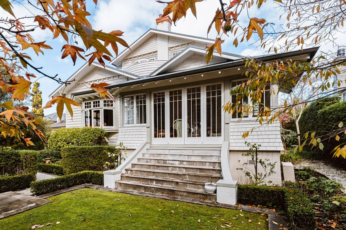 Renovated Arts and Crafts style home with restored timber detailing and landscaped grounds.