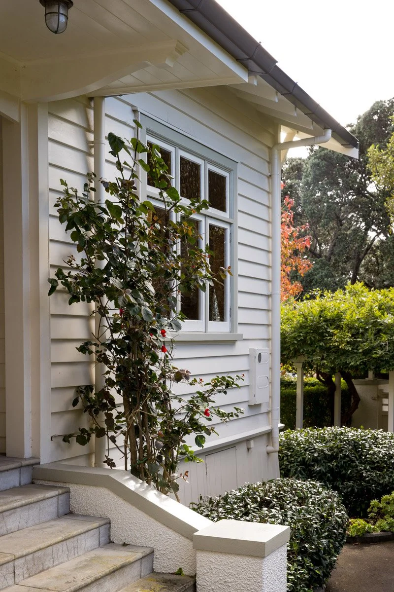 Front elevation of renovated character home featuring traditional architecture and modern upgrades.