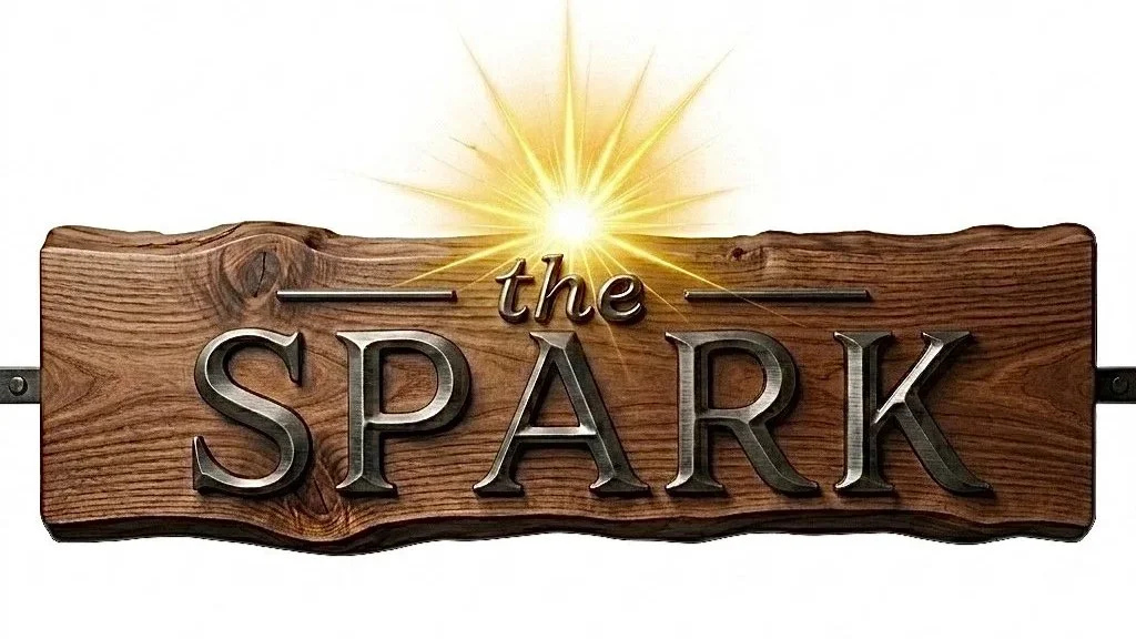 Wooden sign with the words "the SPARK" and a bright golden spark or burst of light glowing above the sign.