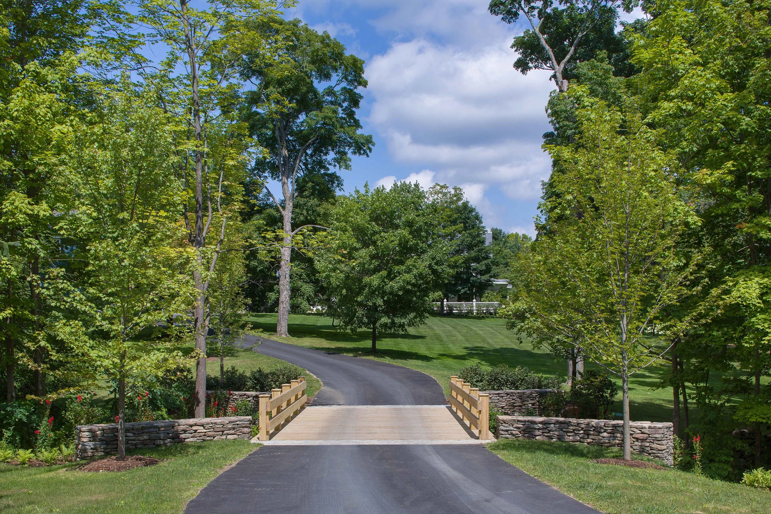01-estate-driveway-bridge-stone-walls-arrival.jpg