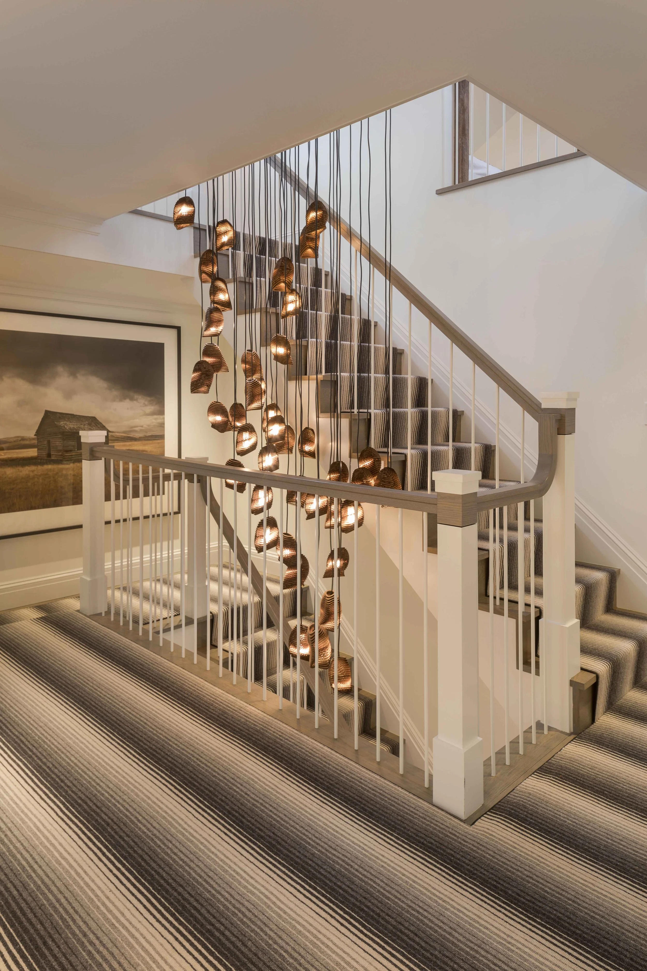 07-pound-ridge-ny-historic-tavern-staircase-sculptural-pendant-light.jpg