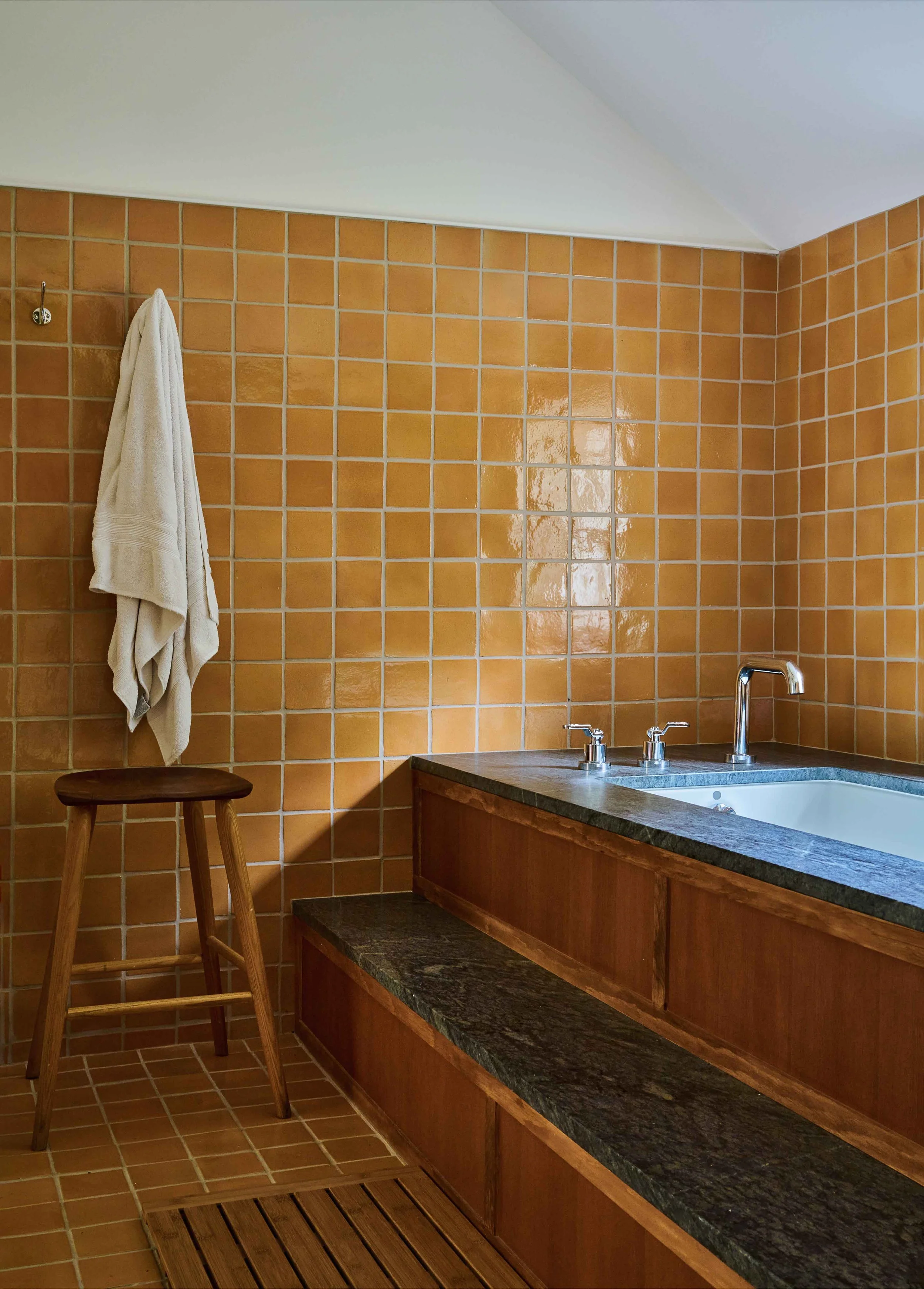 13-hobby-hill-farm-bathroom-terracotta-zellige-tile-soaking-tub-dark-marble-surround.jpg
