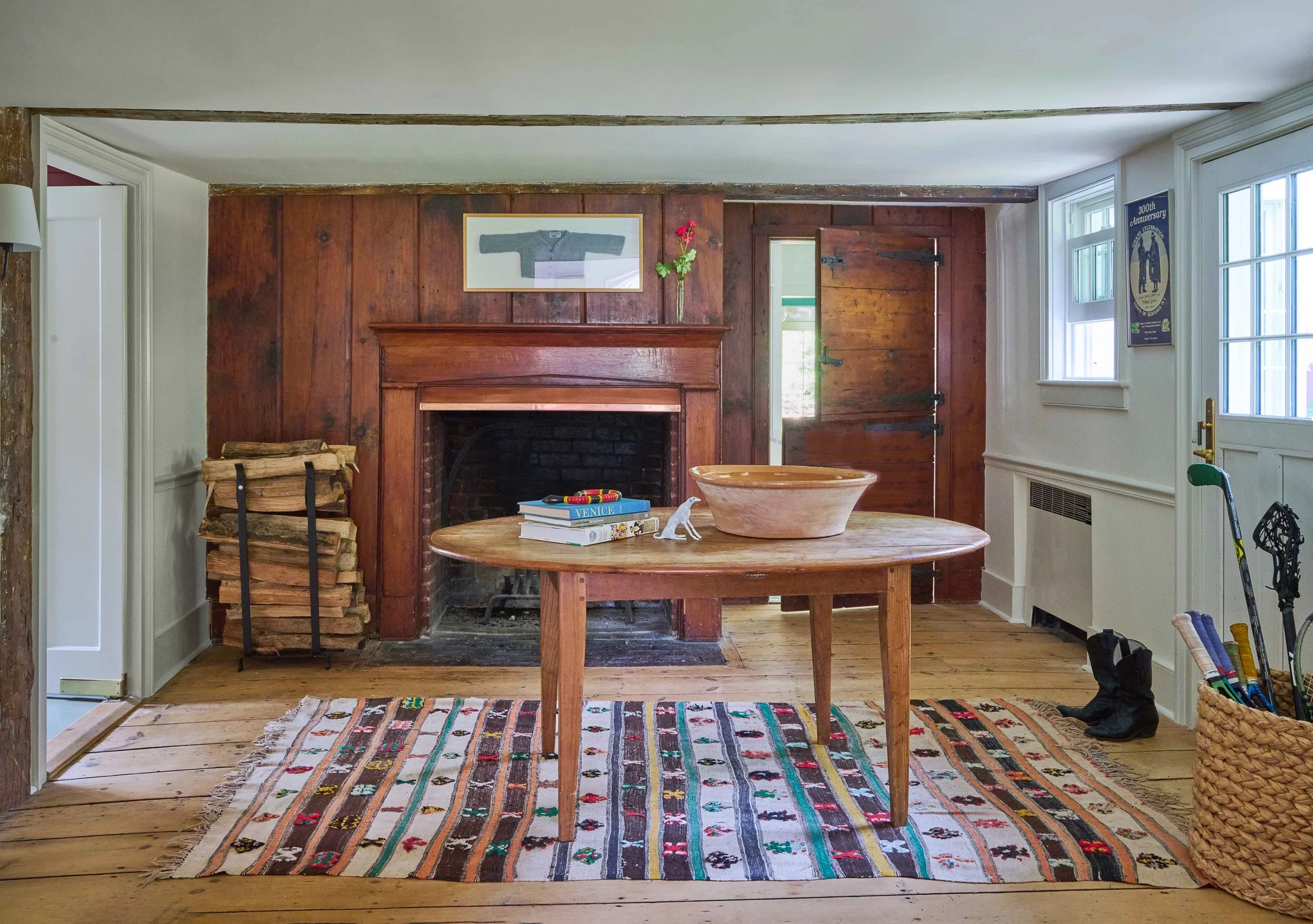 10-hobby-hill-farm-original-living-room-wood-paneling-brick-fireplace-wide-plank-floors.jpg