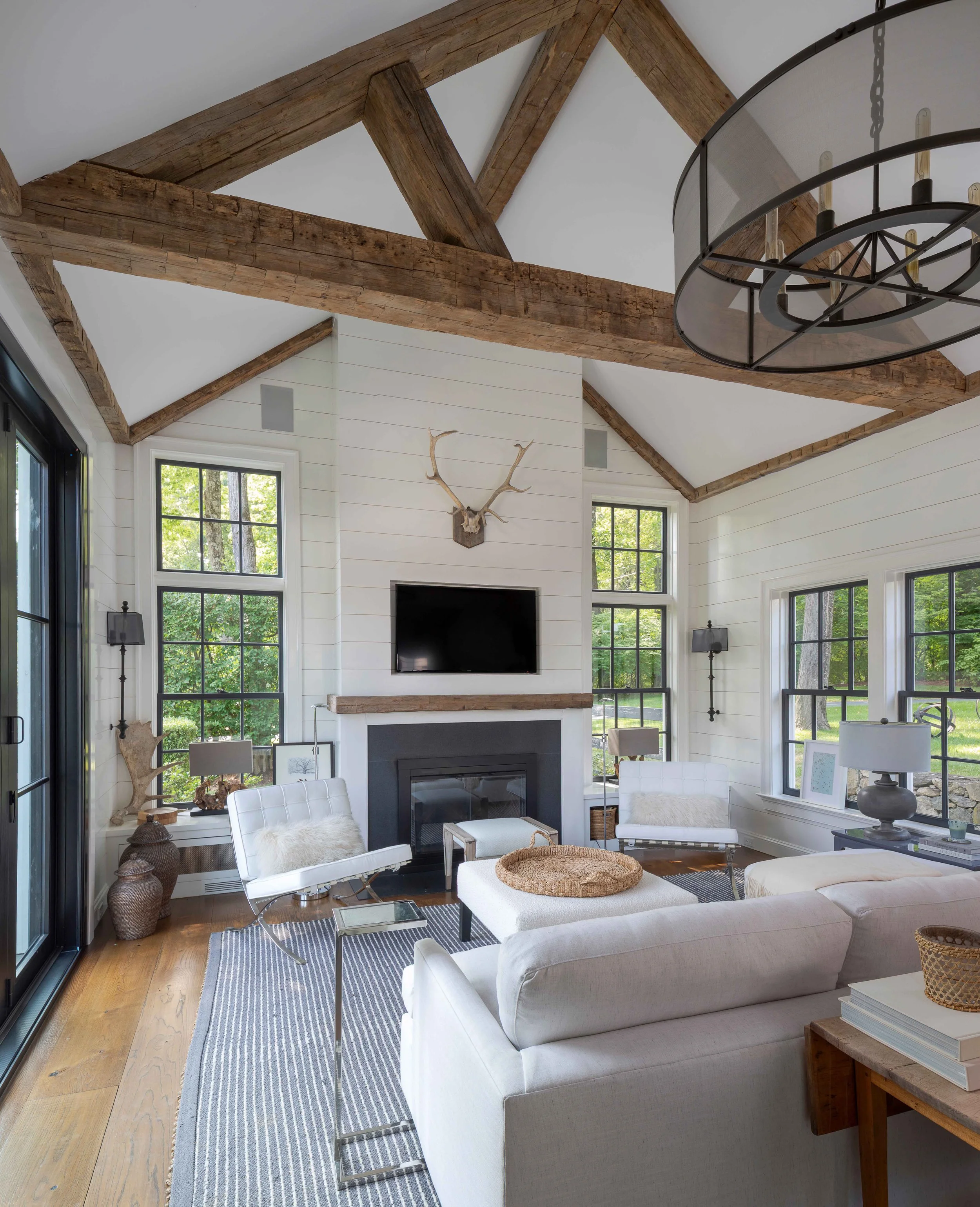 08-pool-house-interior-living-room-fireplace-vaulted-ceiling.jpg
