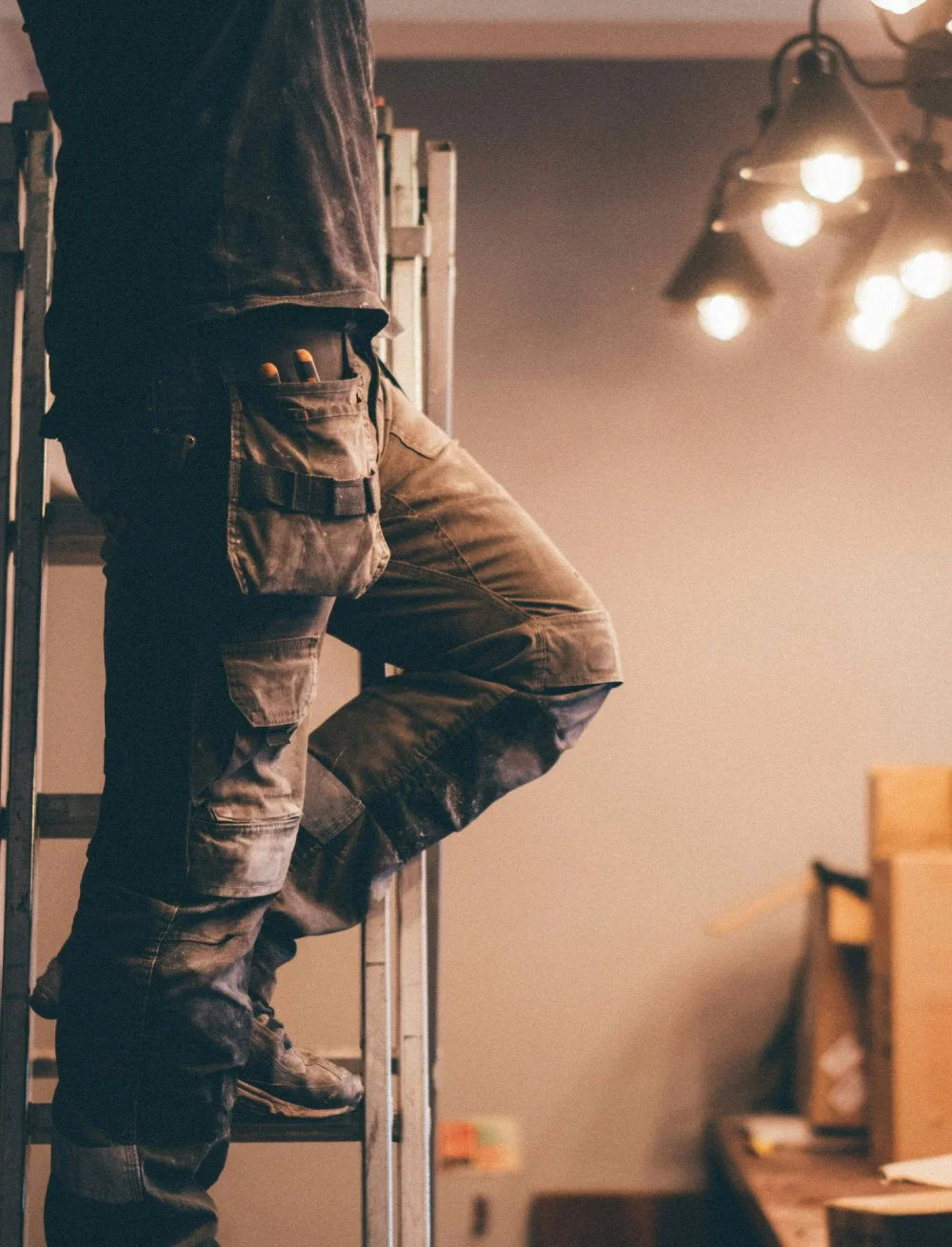 Licensed electrician installing residential lighting fixture in upscale Whatcom County home