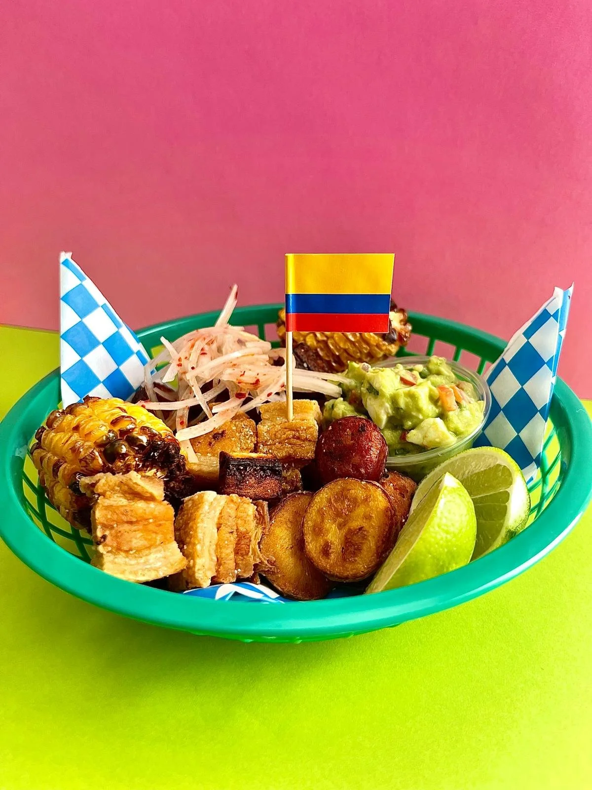 Typical Colombian picada with a variety of ingredients including chicharrón and chorizo.