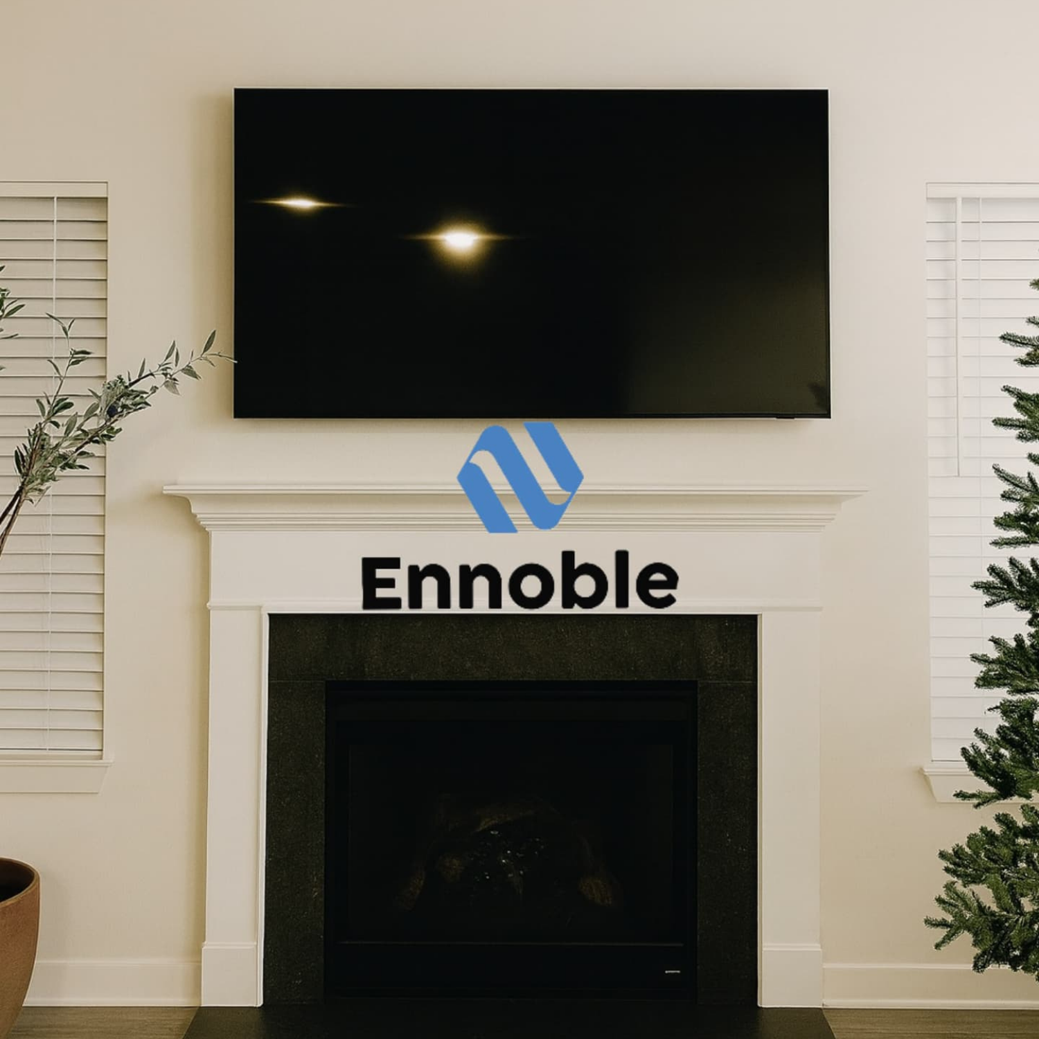 Premium TV mounting and hidden cords installation by Ennoble Smart Home, featuring a clean, floating flat-screen television with zero visible cables over a modern fireplace in Murfreesboro TN.