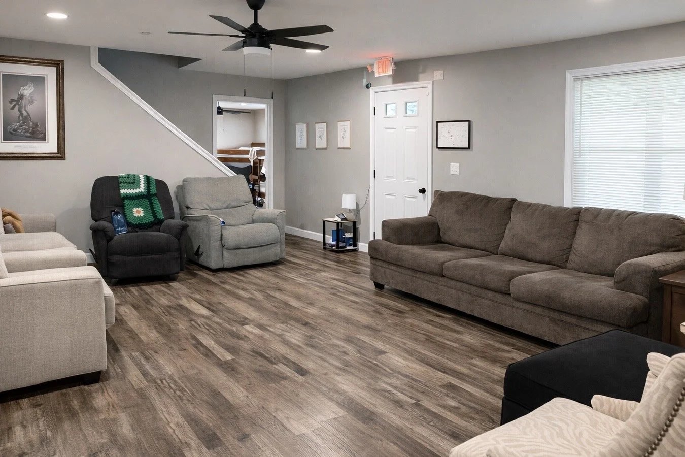 A warm, spacious living room designed for comfort, connection, and a sense of home throughout your healing journey
