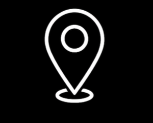 A white location pin icon on a black background.