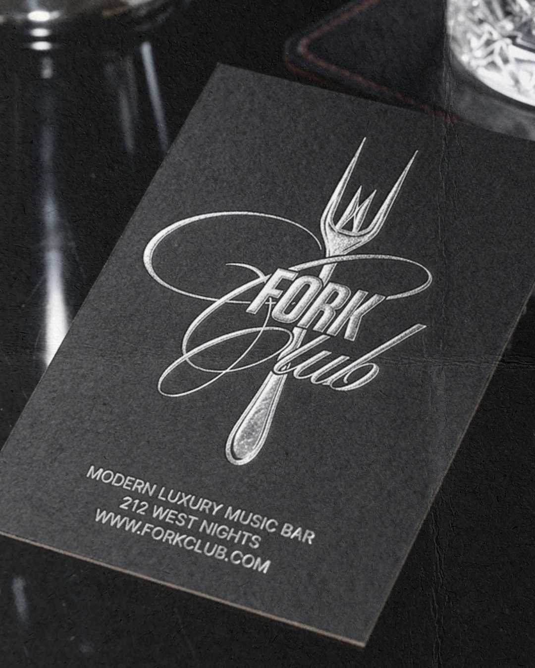 Business card for Fork Club, a modern luxury music bar located at 212 West Nights, with a website at www.forkclub.com, featuring a silver fork design.