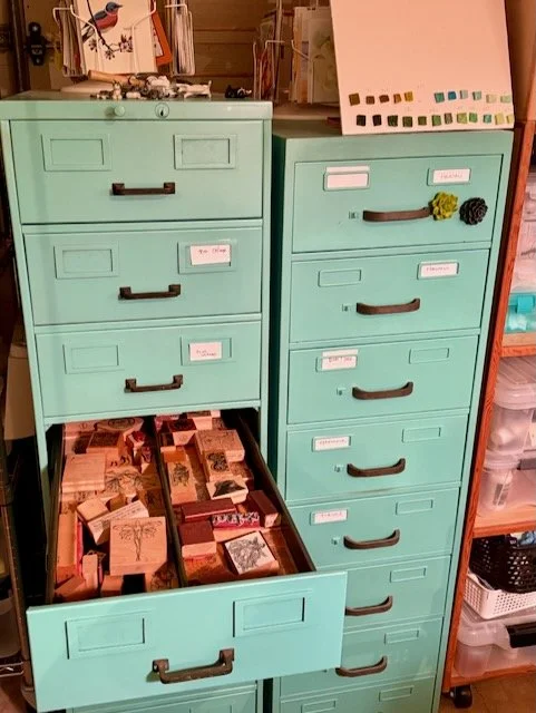 file cabinet full of rubber stamps