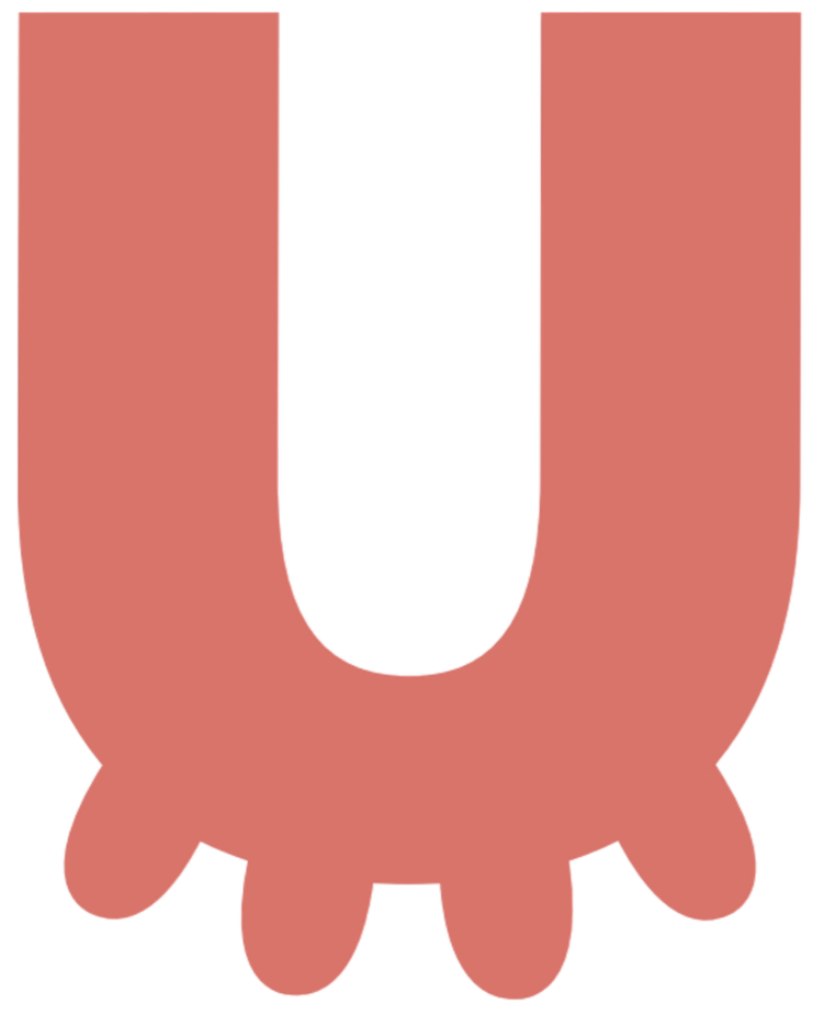 A large, pink, stylized letter Q with rounded edges and small semi-circular shapes at the bottom.
