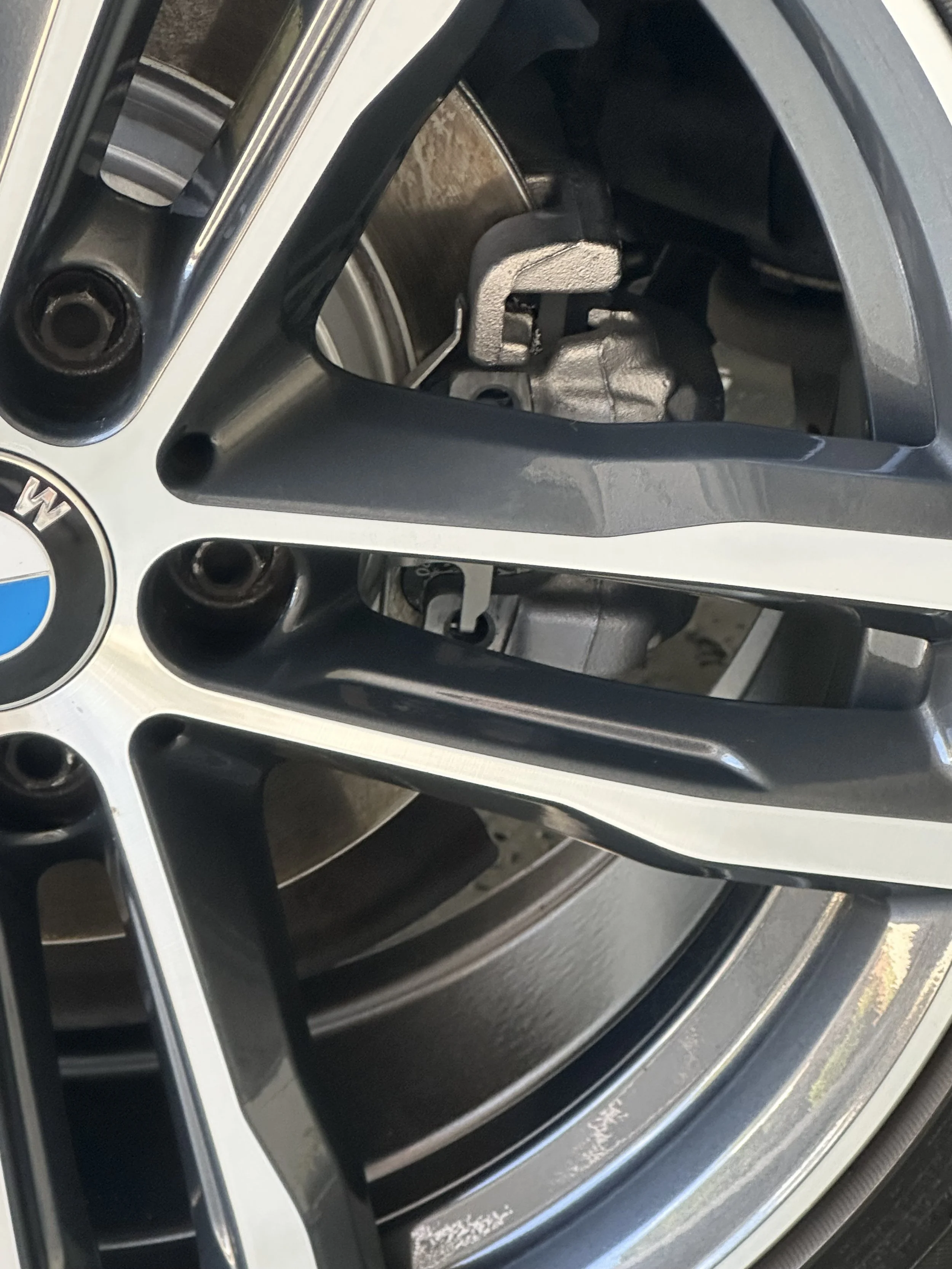 Close-up of a BMW car wheel rim with a visible tire