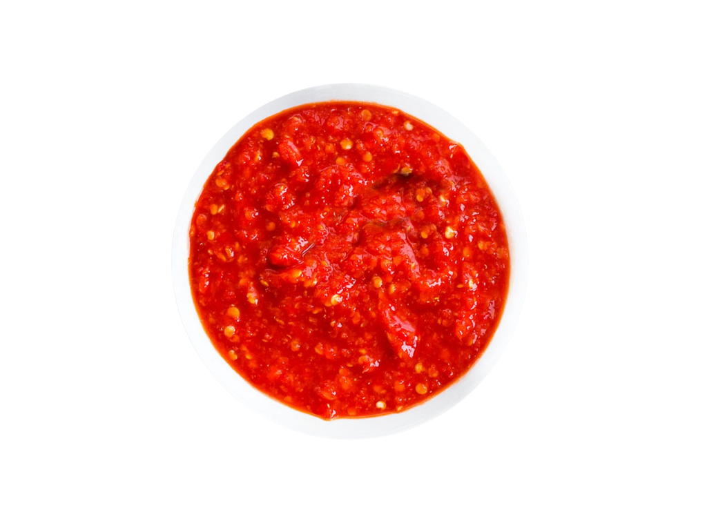 A bowl of red chili sauce with visible tomato chunks and seeds.
