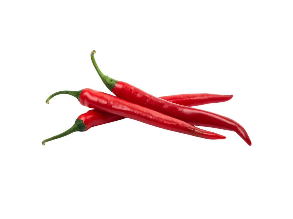 Three red chili peppers on a white surface.