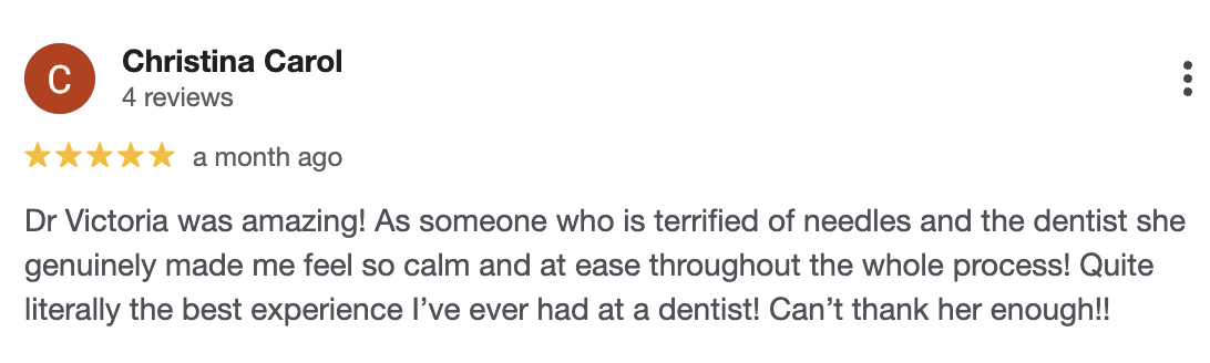 Screenshot of a Google review for Dr. Victoria from Christina Carol praising her for making the dental experience calm and easy, with a five-star rating.