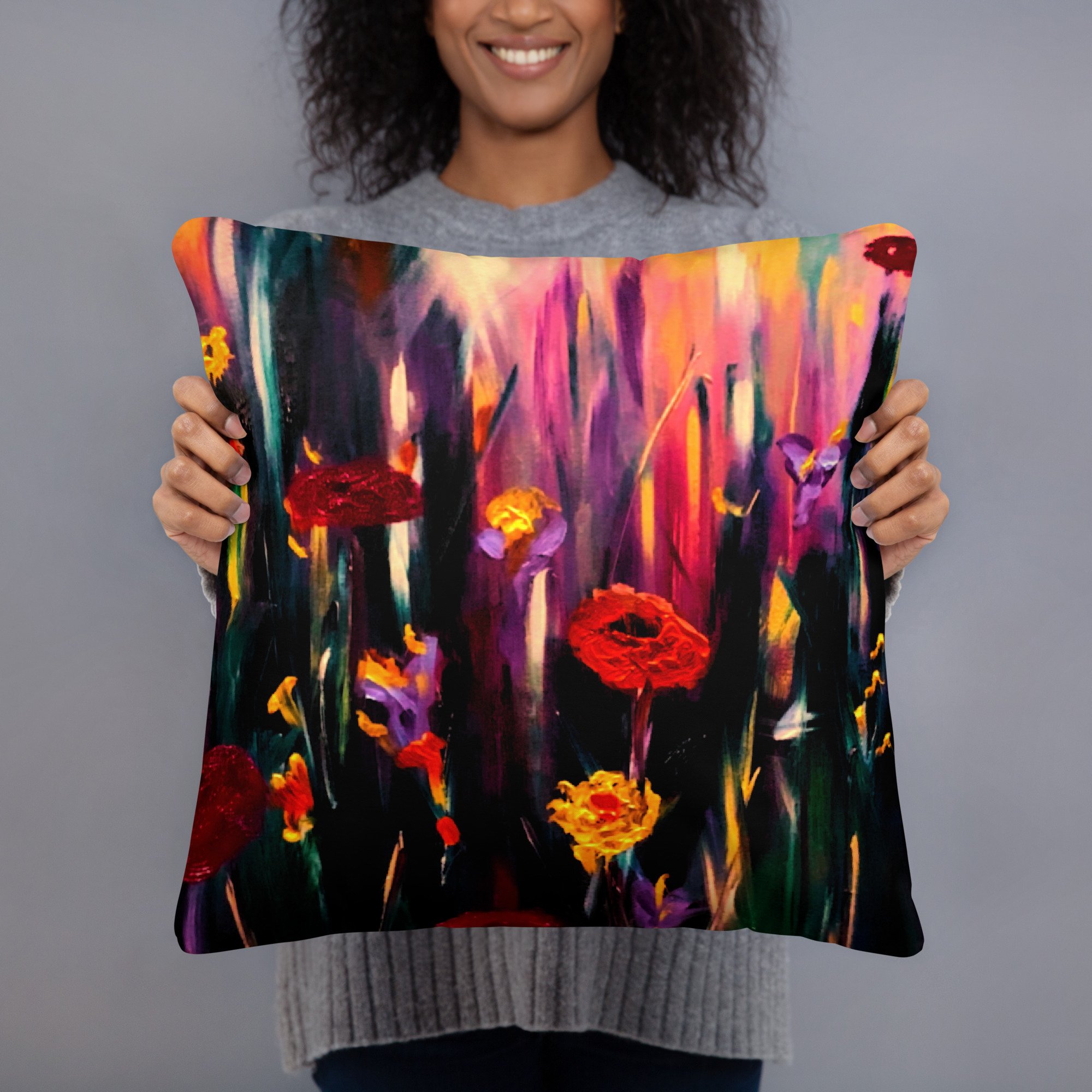 Woman holding a decorative cushion featuring vibrant poppy artwork with bold red and golden flowers, purple blooms and rich expressive colours on a dramatic botanical background.
